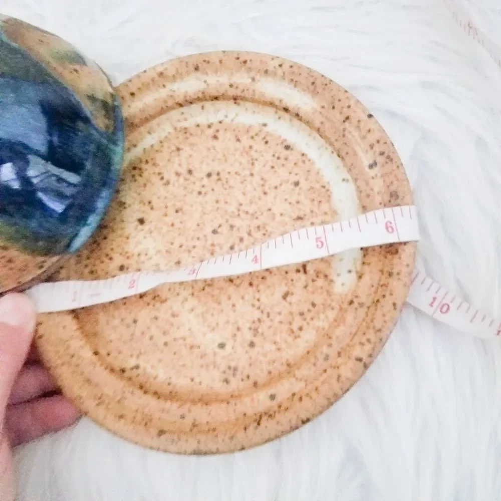 Pottery covered plate earth tones with blue